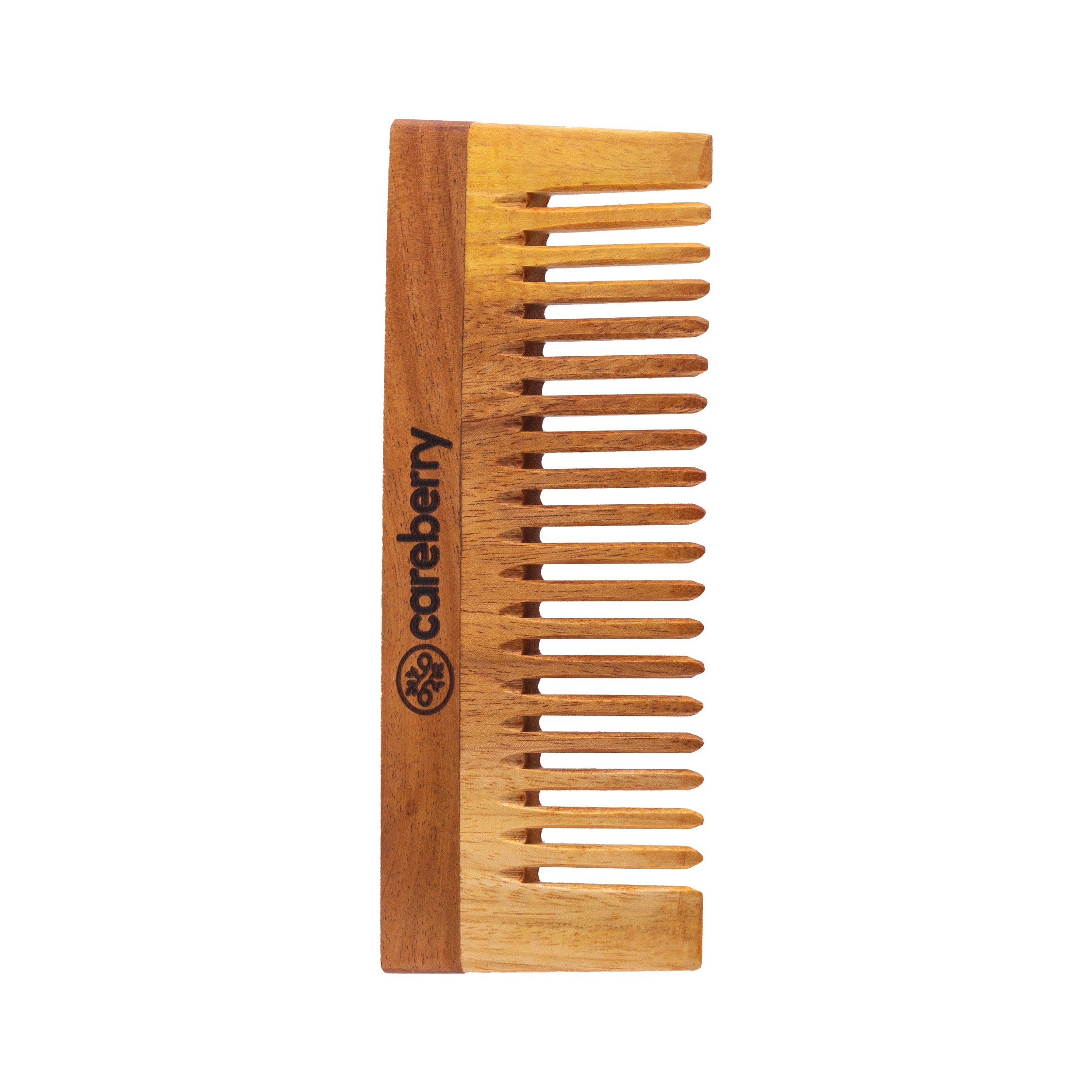 Careberry organic wooden neem comb with fine teeth positioned diagonally with fresh neem leaves scattered on light background, organic natural hair care tool.